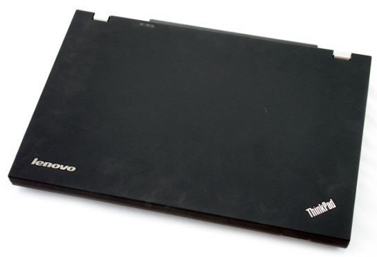 Closed Lenovo ThinkPad W520 showing logos the right way up